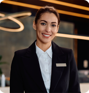Smiling front of house receptionist, symbolising an engaged and efficient workforce managed by Elevate hospitality solutions.
